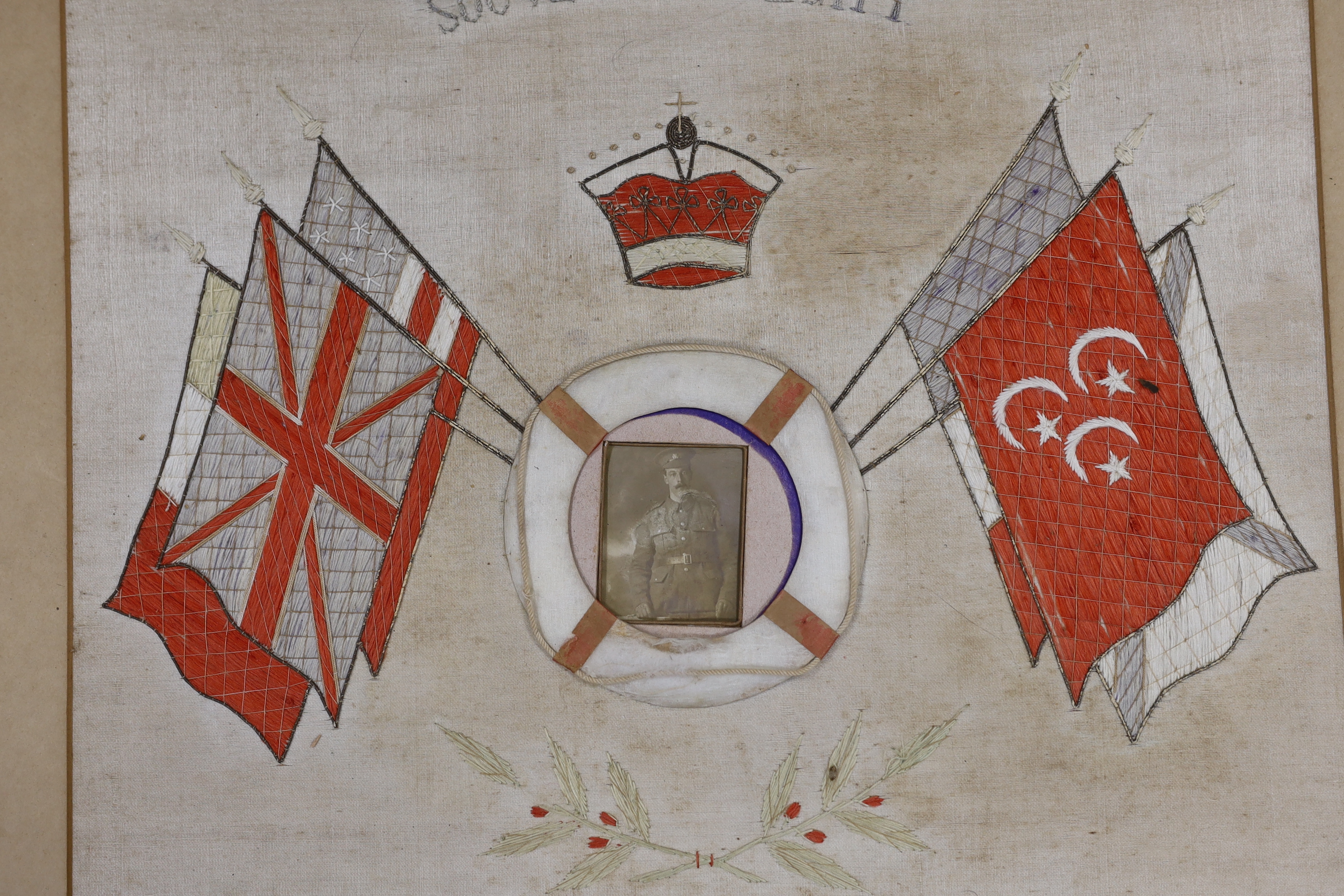 Two First World War souvenir embroideries mounted on boards, one relating to Egypt and another in memory of Laguerre 1914-15-16, both with contemporary photographs of soldiers at the centre, largest 50.5 x 63cm